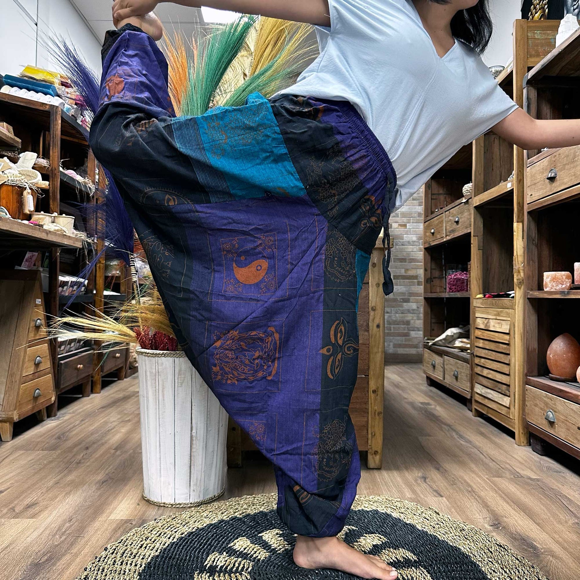 100% Eco-Friendly Cotton Unisex Aladdin Style Yoga and Festival Pants - Purple Multicolour / Himalayan Print product packaging on clean background from Quintessential Holistic Health Ltd