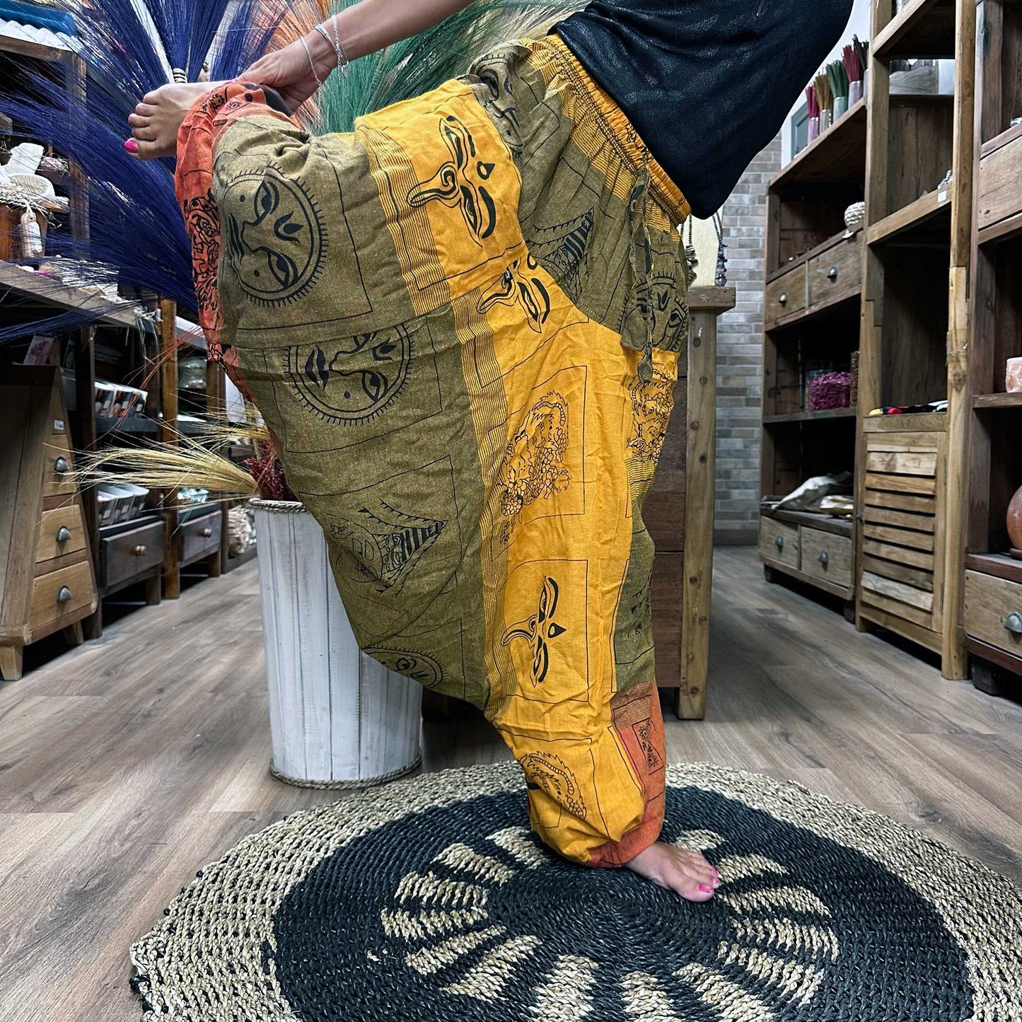 100% Eco-Friendly Cotton Unisex Aladdin Style Yoga and Festival Pants - Orange Multicolour / Himalayan Print product packaging on clean background from Quintessential Holistic Health Ltd