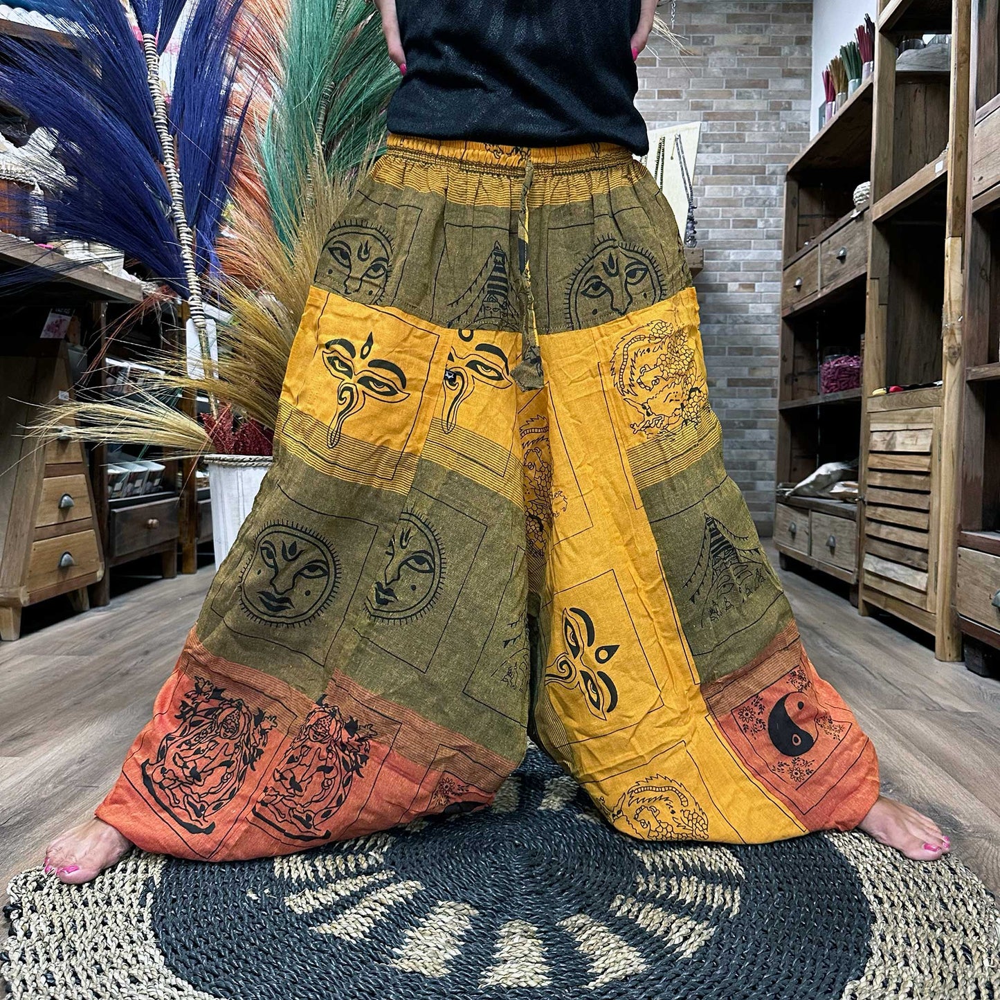 100% Eco-Friendly Cotton Unisex Aladdin Style Yoga and Festival Pants - Orange Multicolour / Himalayan Print product packaging on clean background from Quintessential Holistic Health Ltd